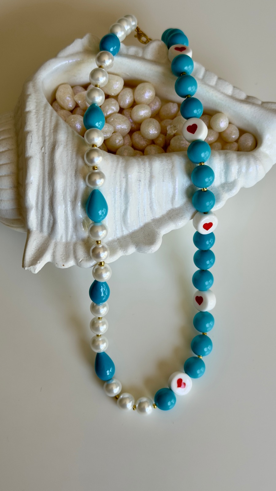 Handmade blue necklace with pearl accents